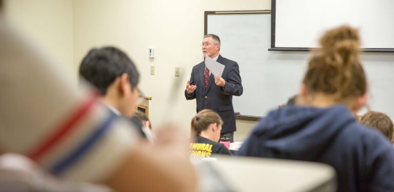 HSU Professor giving a lecture to a room full of students