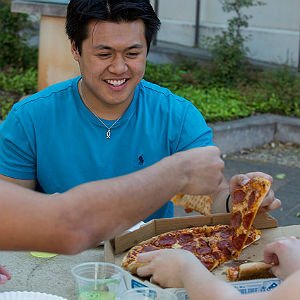 Scholarship awarded student enjoys pizza with fellow students