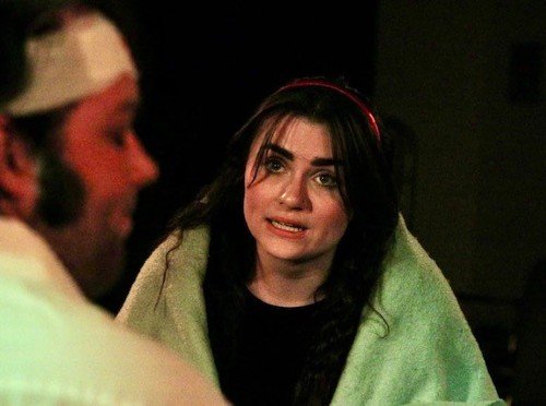 Dani performing in a theatre show.