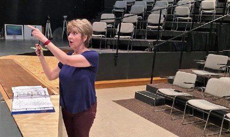 Victoria Spangler directing a theatre practice.