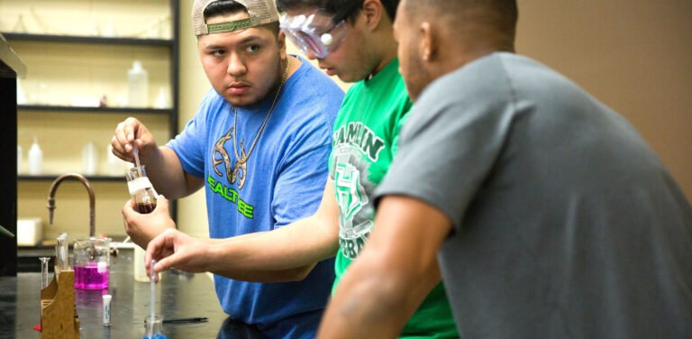 Chemistry students collaborate on a science experiment