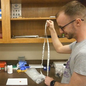 Criminal Justice student conducting examination in classroom