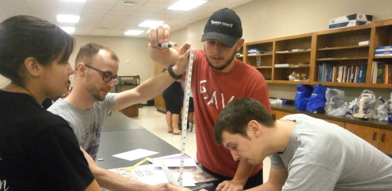 Forensic studies students conducting experiment in lab