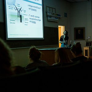 Science Education professor conducting lecture with overhead projector