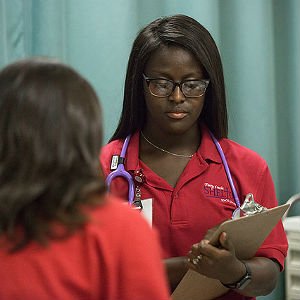 HSU Nursing student looking at her clipboard