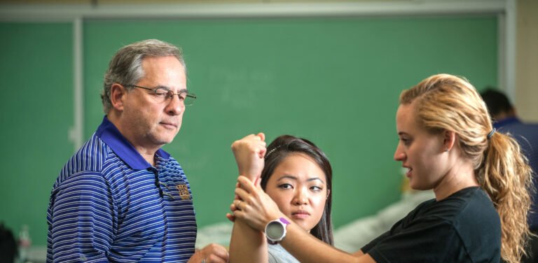 Physical Therapy student demonstrating her knowledge to the professor