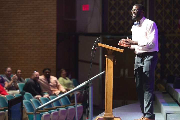 Dr. Travis Craver giving a speech in a HSU auditorium