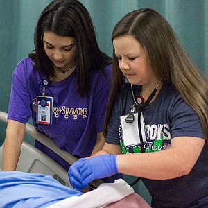 Two HSU nursing students checking vital signs on dummy