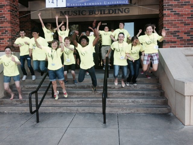 HSU piano summer camp students jumping in group photo