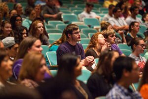 HSU students listen to speaker in auditorium