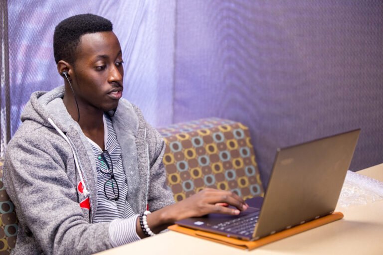 HSU Master of Science in Information Science student working on his laptop