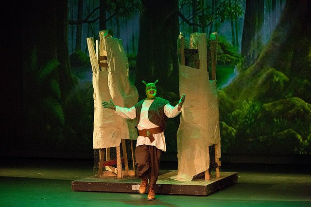 HSU Theater Program student dressed as Shrek performing on stage