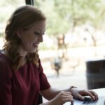 HSU Finance Program student working on her laptop