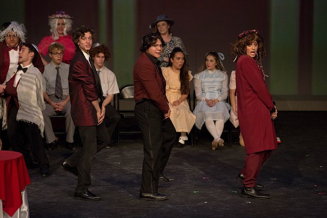 HSU theater students singing and performing in costume on stage