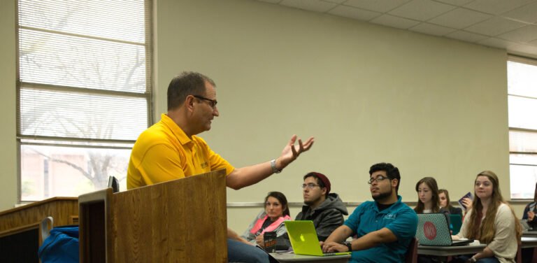 Cynthia Ann Parker College of Liberal Arts professor speaking to classroom of students