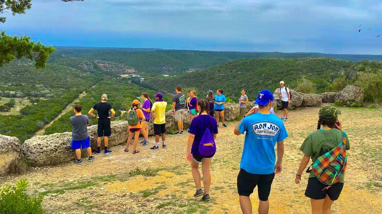 Cynthia Ann Parker College of Liberal Arts honor students enjoy scenic view on a mountain top