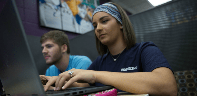 HSU students working on their laptops in the library