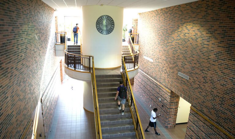 aerial inside view of Kelley College of Business staircase with official Kelley College seal