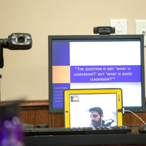 Professor delivering lecture via video chat