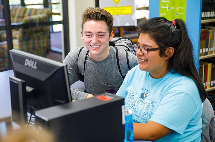 HSU students working studying together on a computer