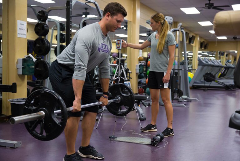 HSU student doing dead lift weights at the campus gym