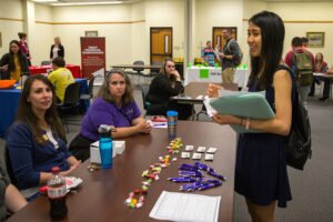 Students hosting an event at the Cynthia Ann Parker College of Liberal Arts