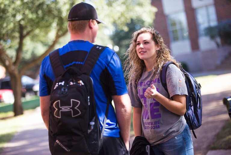 Photo of students explaining stuff to other student