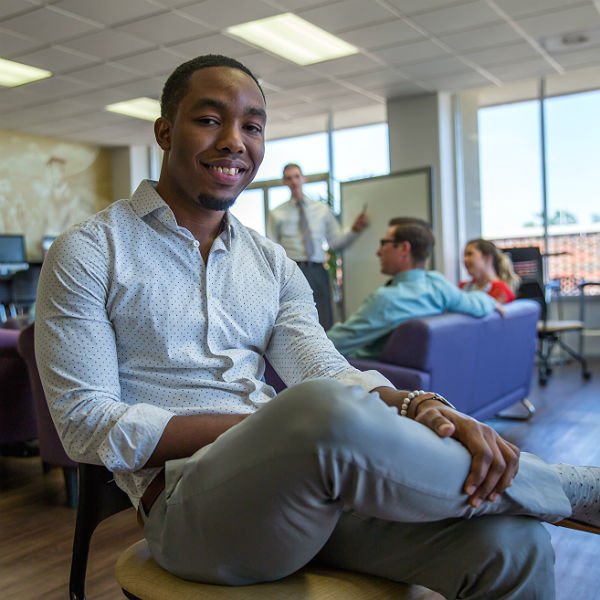 HSU student sitting in the Kelly College lounge