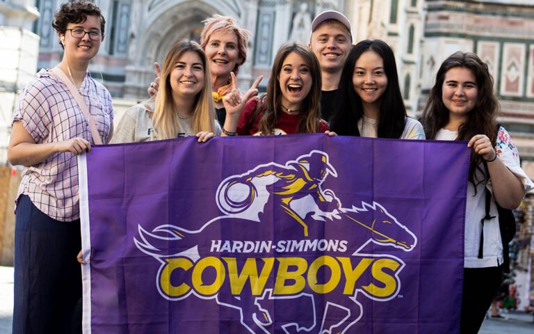 Photo of students holding HSU spirit banner.