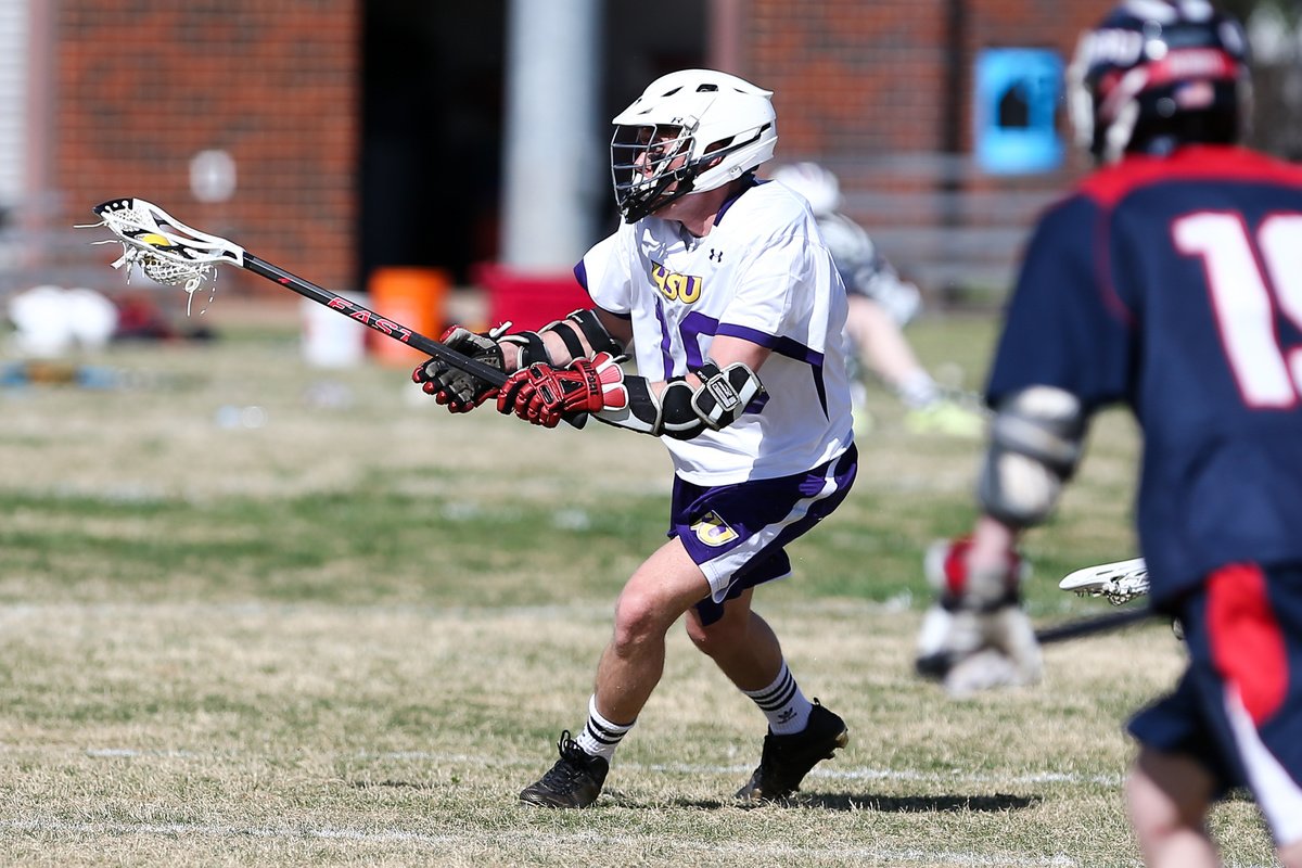 A men's lacrosse club member plays in an HSU match.