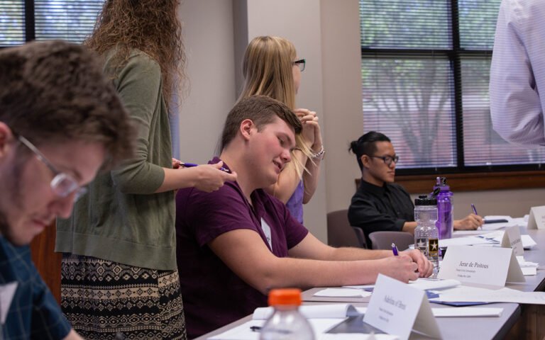 Photo of HSU students participating in Mock United Nations activities.