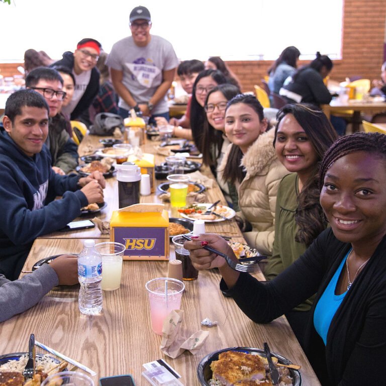 Photo of Internationals students eating together in cafeteria