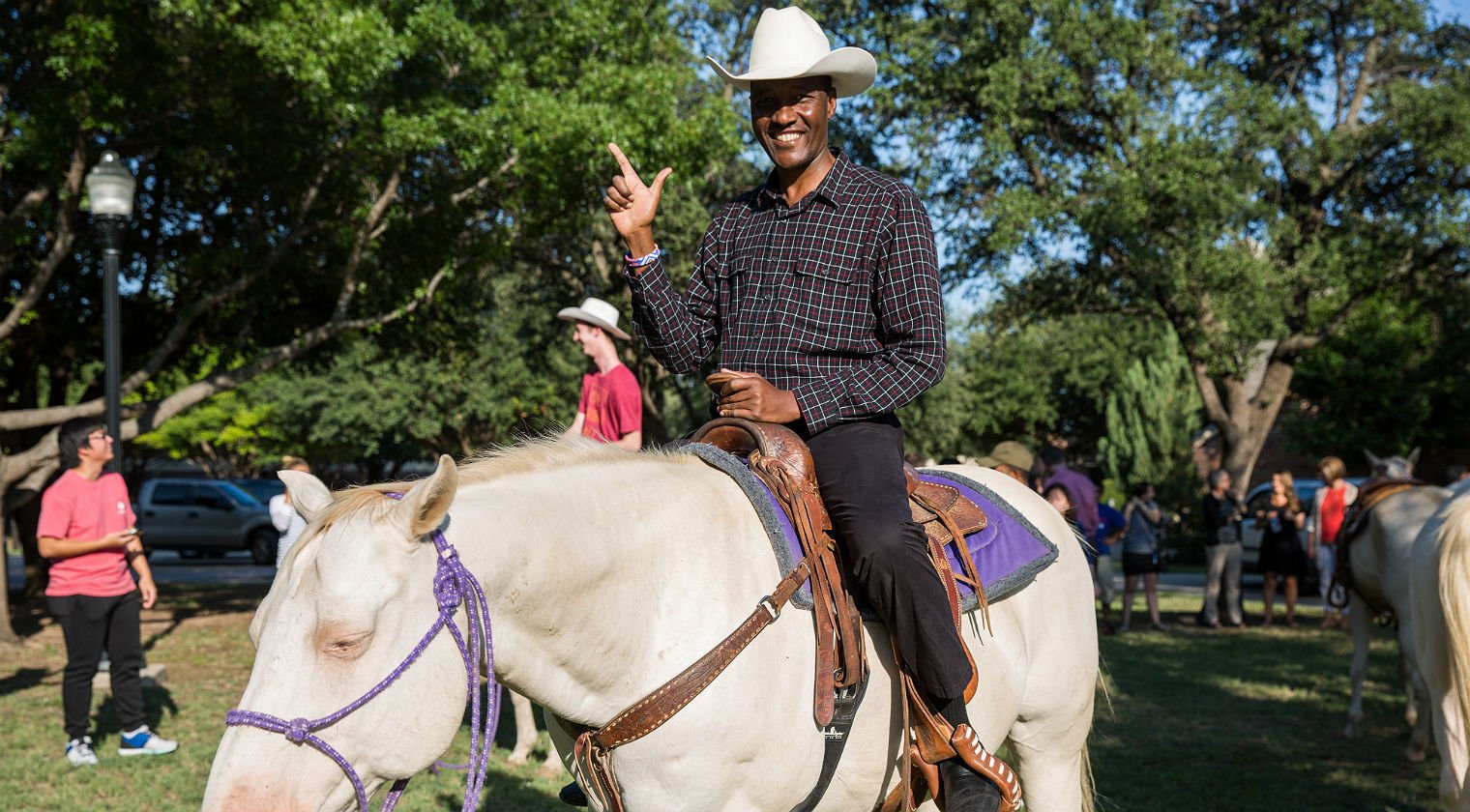 Photo of Kisemei riding white horse