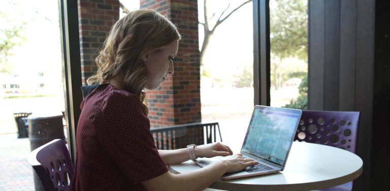 HSU student working on her laptop