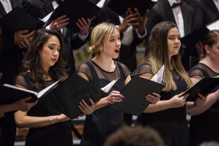 Madeline Queen '19 and other sing in the HSU Choir