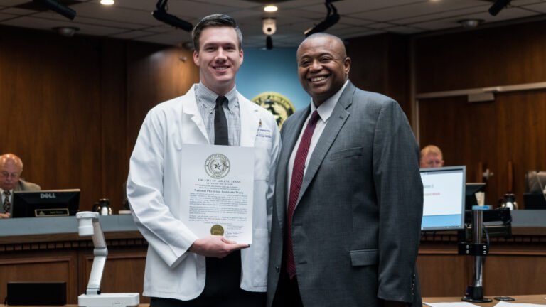 HSU Physician Assistant receiving an award from professor