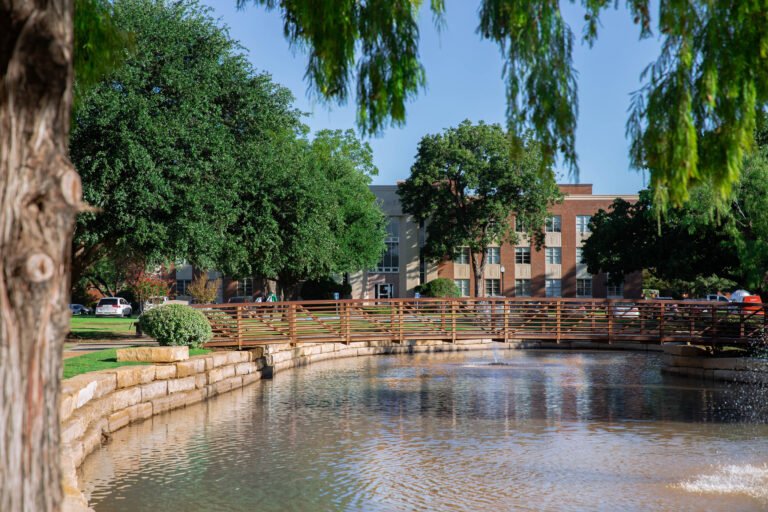 Outside view of Anderson Hall residencies next to  pond