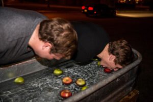 bobbing for apples during Oksoberfest 2018