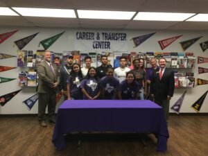 Dr. Chris McNair, provost (far left) and Jim Jones, assoc. vice president for enrollment services (far right) join students from Ranger College during the signing of the articulation agreement.