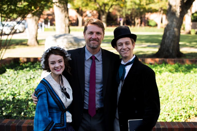 Michael Kelly and Bridgett Mistrot as James B. and Mary Simmons with vice president for university mission and strategic vision, Dr. Travis Frampton.