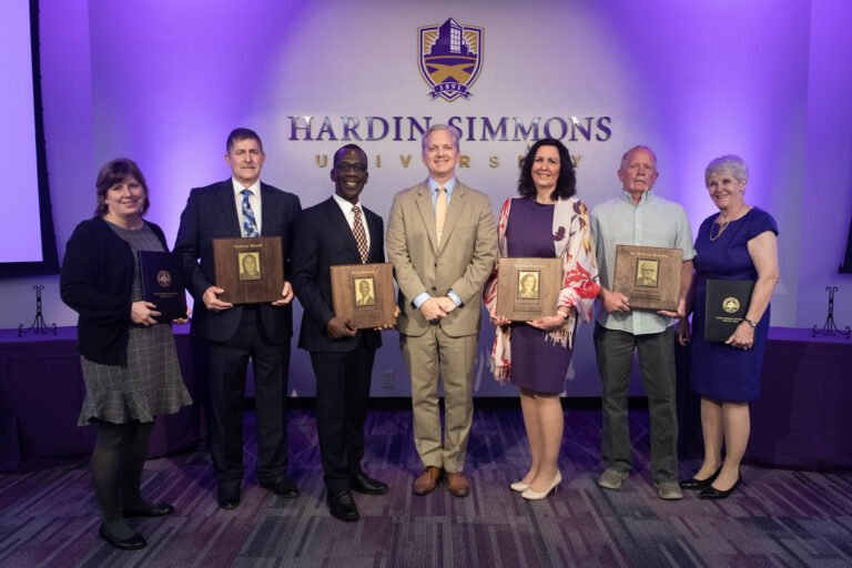 The 2019 Hall of Leaders Inductees pause to take a photo with HSU President Eric Bruntmyer.