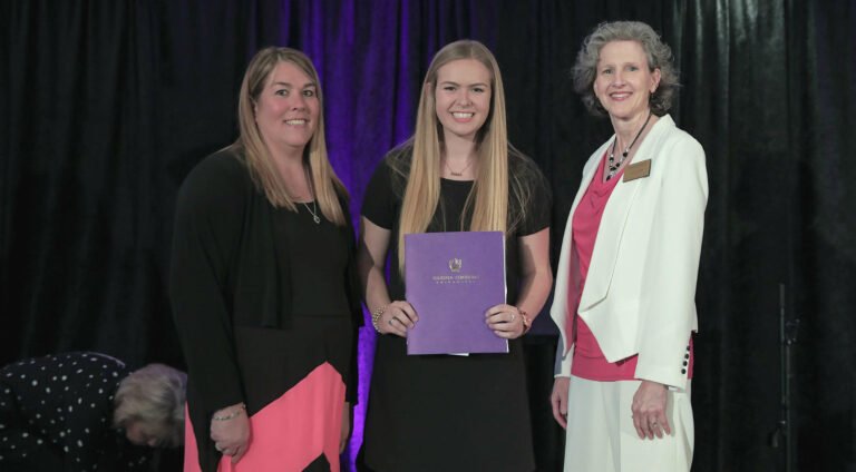 Whitney Boyd, the 2019 Round Table scholarship recipient, poses after receiving her award.