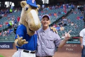 President Eric Bruntmyer poses with the Texas Rangers mascot.
