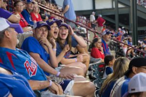 Hardin-Simmons students on the edge of their seats as they watch the Texas Rangers play.