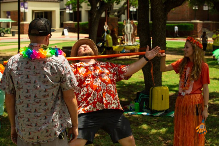 A student does the limbo at an HSU summer camp.