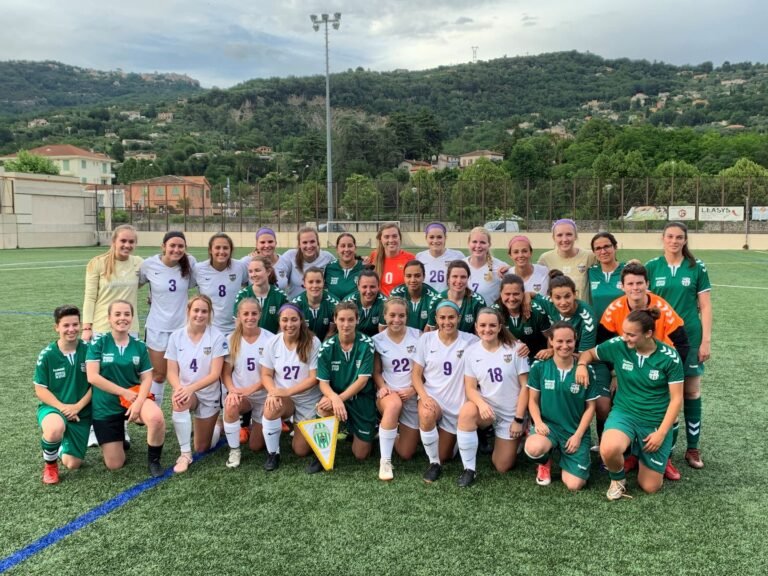 Members of the HSU women's soccer team pose with members of an international team that they competed against while abroad.