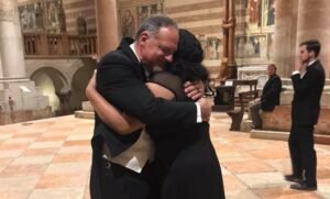 Serayah Peters gives Dr. Wright an emotional hug after the choir's final performance.