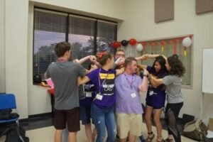 Campers bond together by playing the game "Human Pretzel."