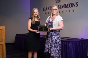Elizabeth Bygel recieves an Outstanding Marketing Student award.