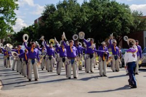 The World Famous Cowboy Band marches in a parade.